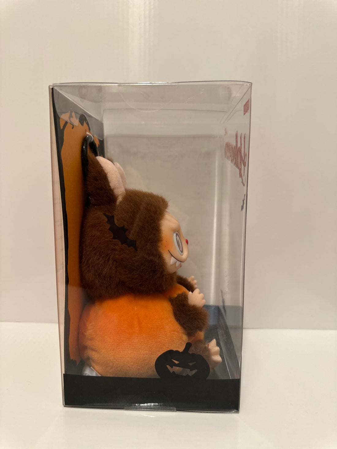 Pop Mart Halloween Labubu – Sitting Pumpkin Vinyl Plush Pendant (Limited Edition)